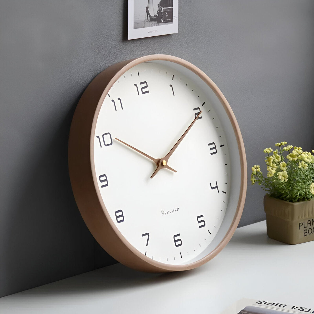 Wood frame wall clock on a wall