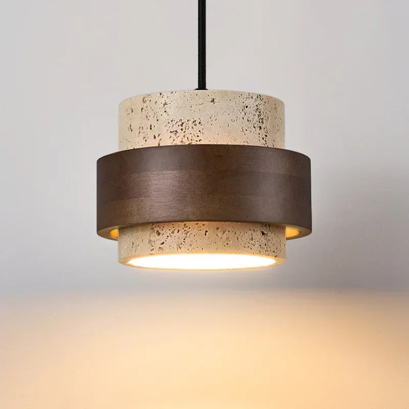 Stone pendant light with a walnut-colour ring, lit from below
