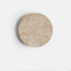 Cave-stone textured round wall light, lights off, front view