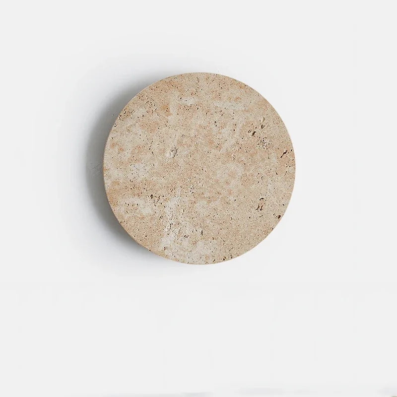 Cave-stone textured round wall light, lights off, front view
