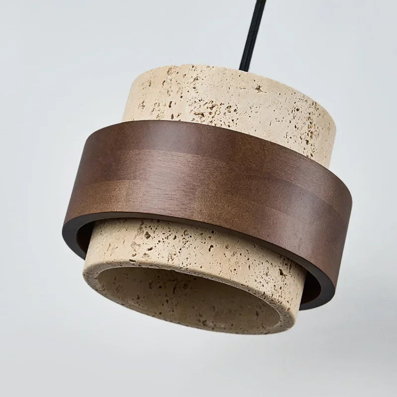 Stone and walnut pendant tilted to show the open underside