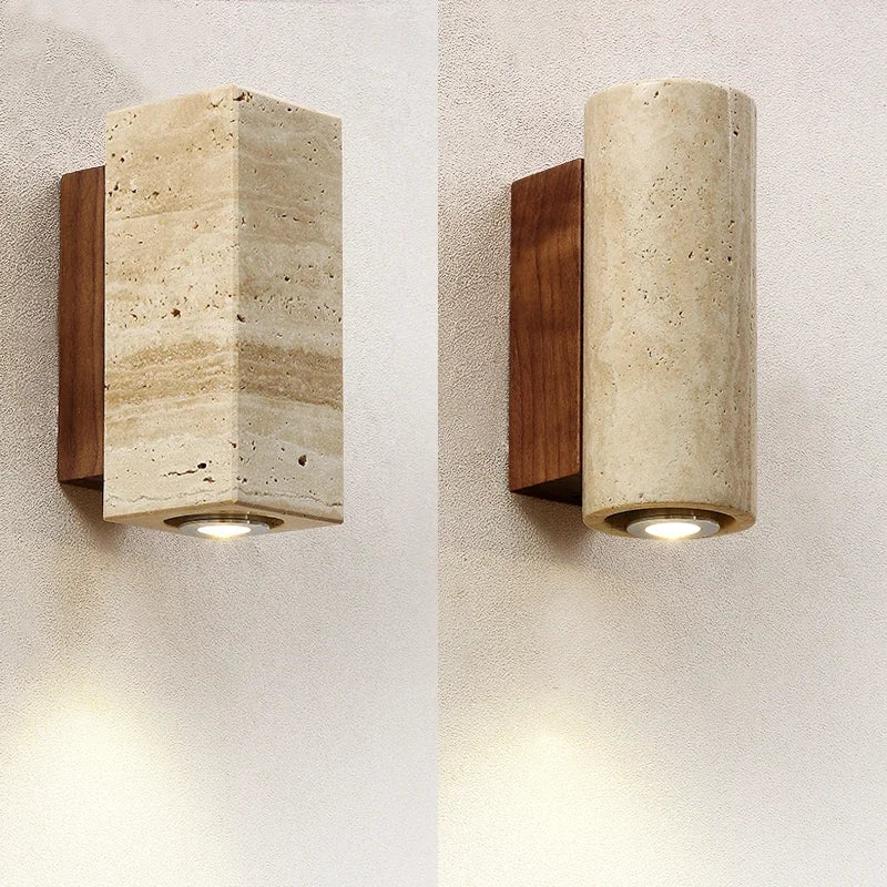 Square and round stone wall sconces side by side