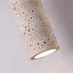 Close-up of the pitted stone-look texture and lit opening